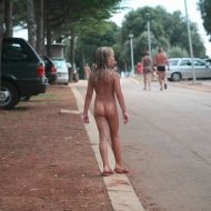Naturist Child on Sidewalk