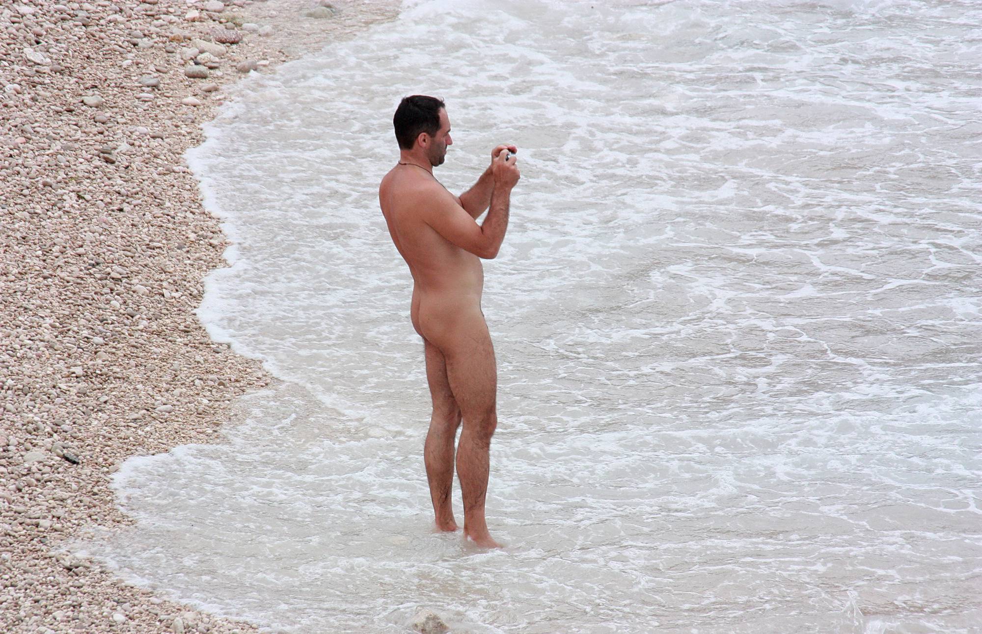 Nudist Photos Wading In Coastal Waves - 1