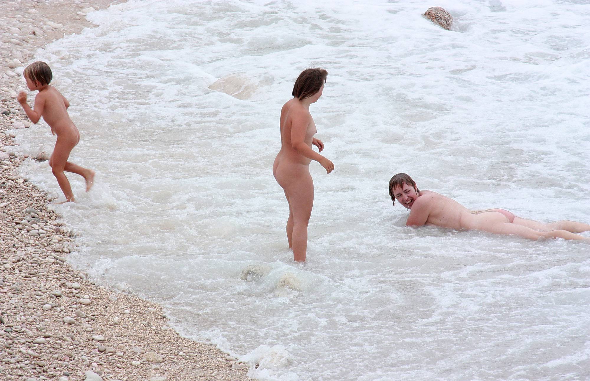 Nudist Pictures Wading In Coastal Waves - 2